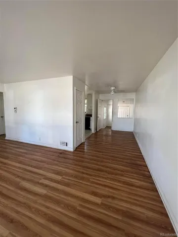a view of a livingroom with wooden floor
