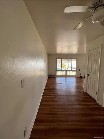 a view of gallery with wooden floor