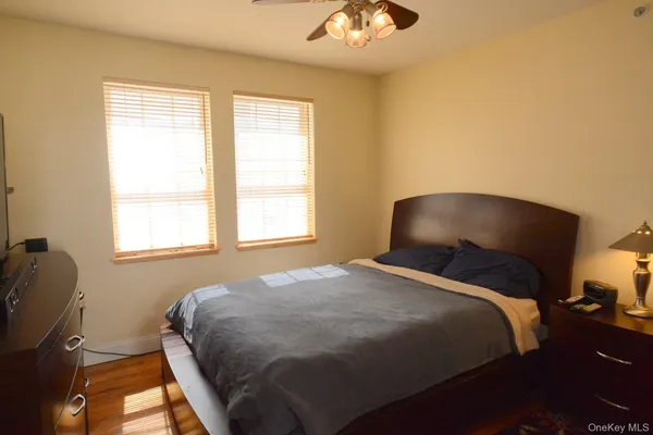 a bedroom with a bed and a chair
