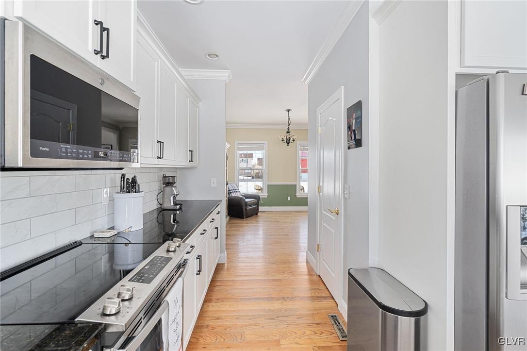 2930 Willow Street Coplay, PA 18037 - Photo 26 of 50 a kitchen with stainless steel appliances a microwave a stove and white cabinets