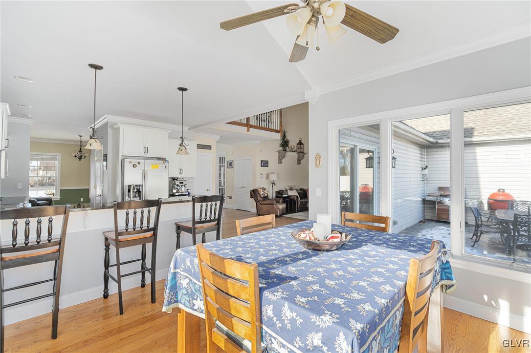 2930 Willow Street Coplay, PA 18037 - Photo 28 of 50 a view of a dining room and livingroom with furniture wooden floor and a chandelier