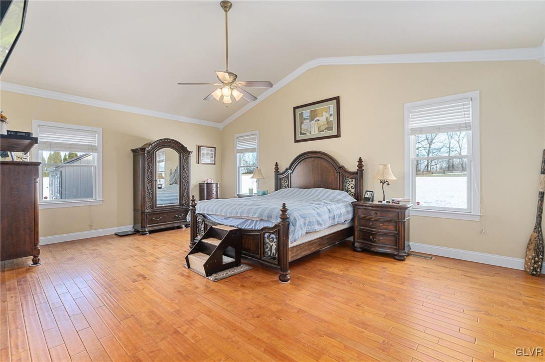 2930 Willow Street Coplay, PA 18037 - Photo 30 of 50 a bedroom with a bed and a chandelier