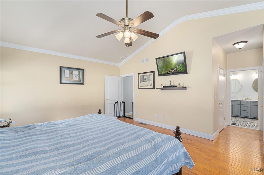 2930 Willow Street Coplay, PA 18037 - Photo 32 of 50 a bedroom with a bed and a chandelier