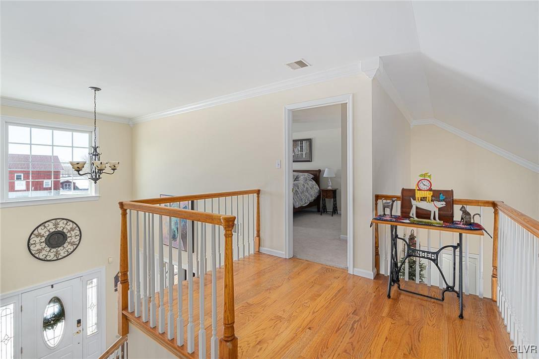 2930 Willow Street Coplay, PA 18037 - Photo 37 of 50 a view of a hallway to room with wooden floor and furniture