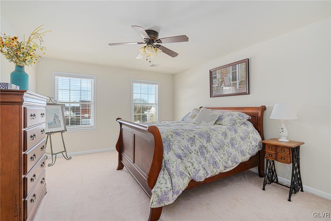 2930 Willow Street Coplay, PA 18037 - Photo 38 of 50 a bedroom with a bed and a chandelier