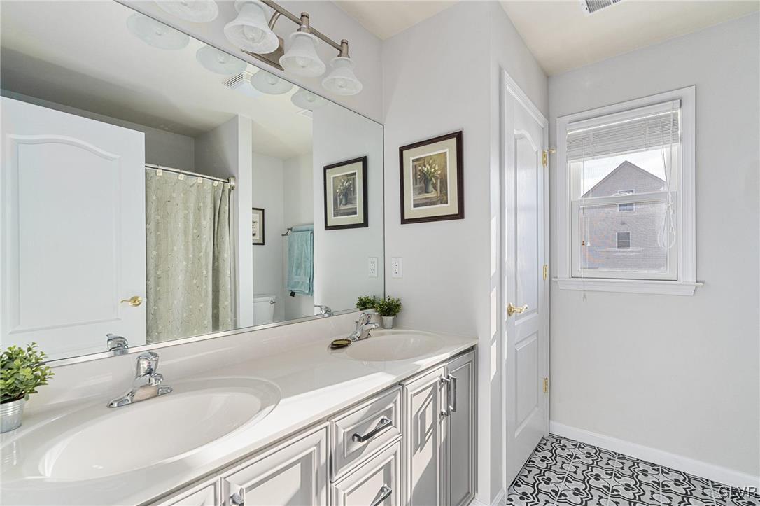 2930 Willow Street Coplay, PA 18037 - Photo 40 of 50 a bathroom with a sink a vanity and a mirror