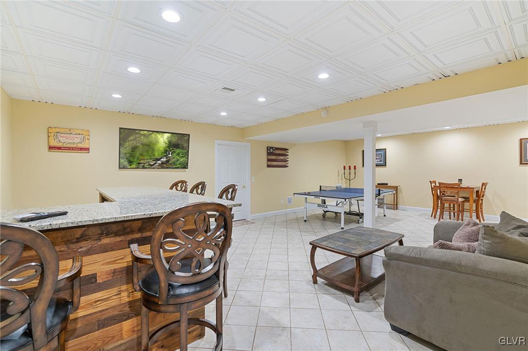 2930 Willow Street Coplay, PA 18037 - Photo 41 of 50 a living room with furniture and a flat screen tv