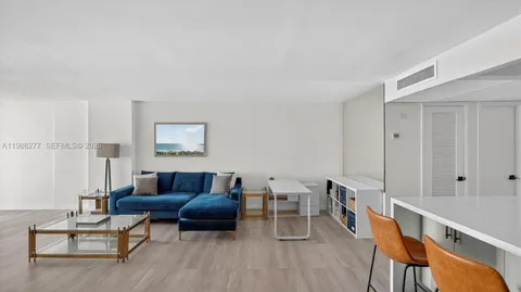 a kitchen with stainless steel appliances a stove a sink and a refrigerator
