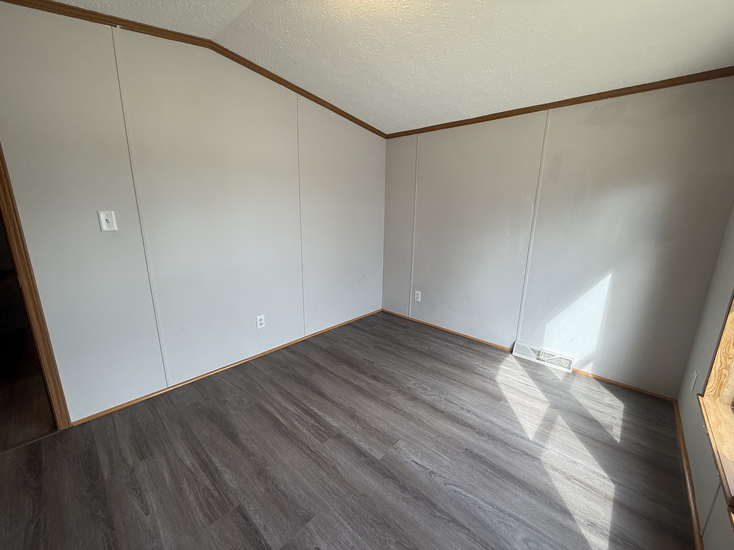 317 Pleasant Terrace Matteson, IL 60443 - Photo 17 of 23 a view of an empty room with wooden floor