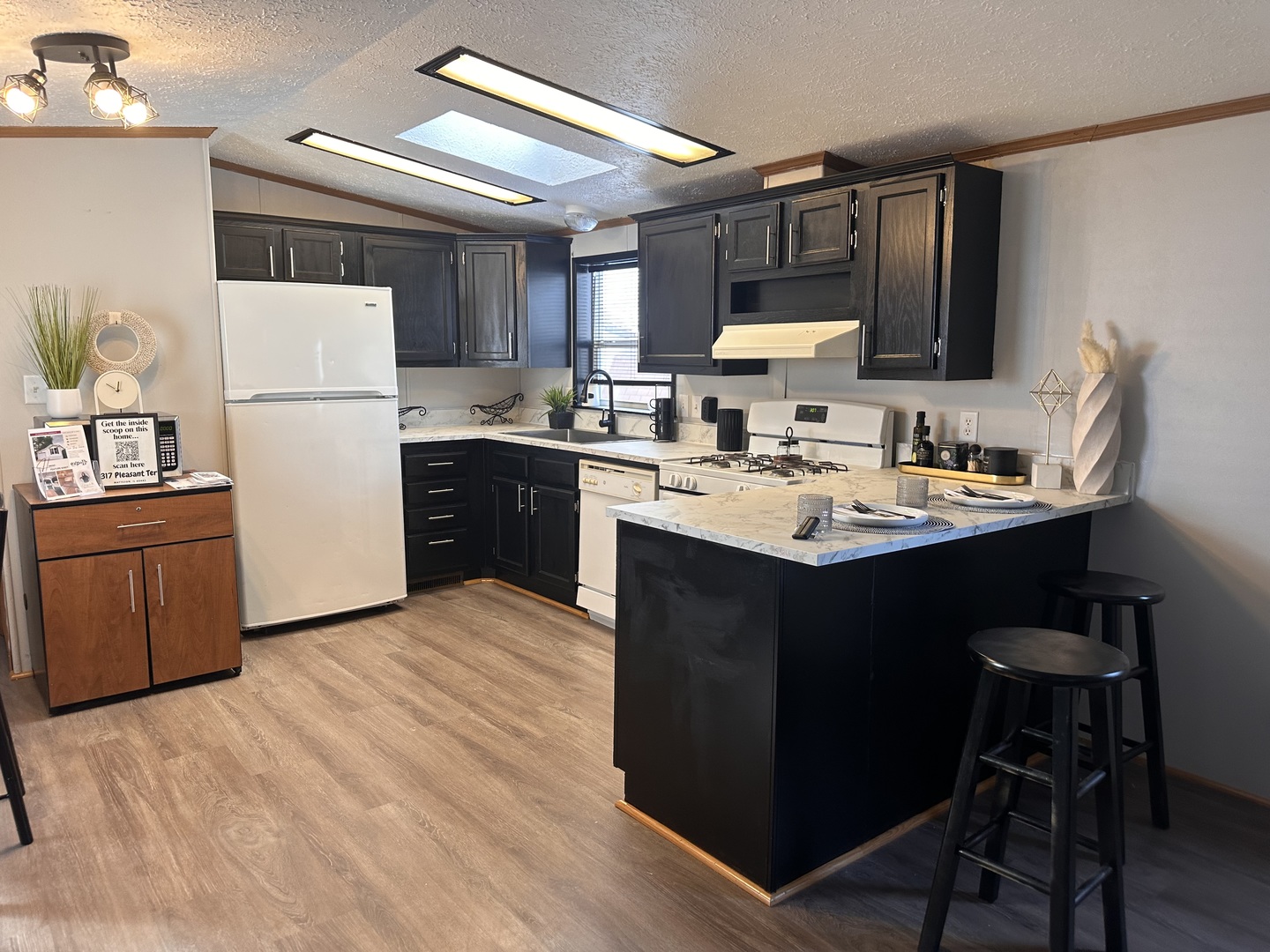 317 Pleasant Terrace Matteson, IL 60443 - Photo 2 of 23 a kitchen with a sink a stove a refrigerator and a refrigerator