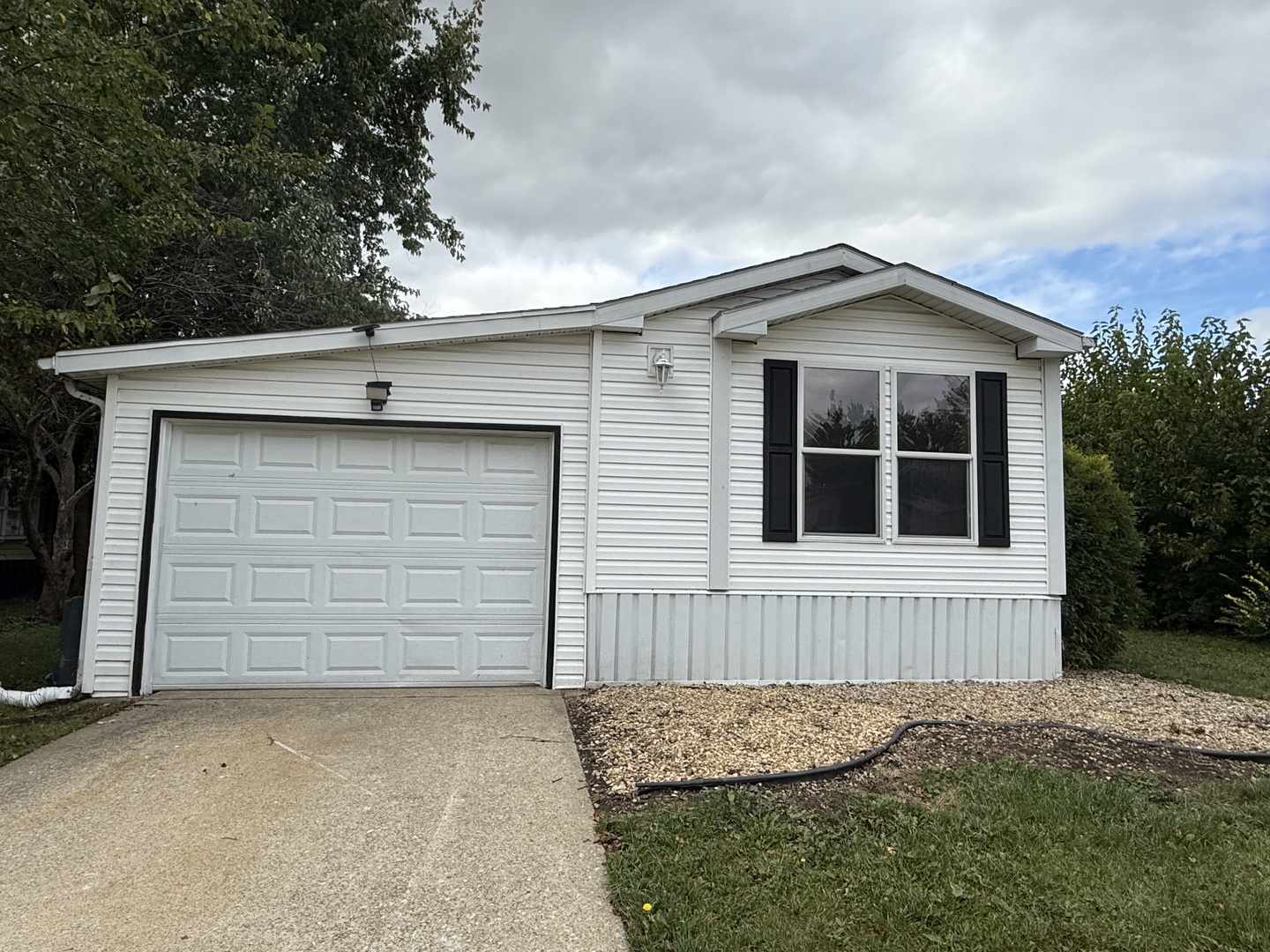 317 Pleasant Terrace Matteson, IL 60443 - Photo 23 of 23 a front view of a house with a yard and garage