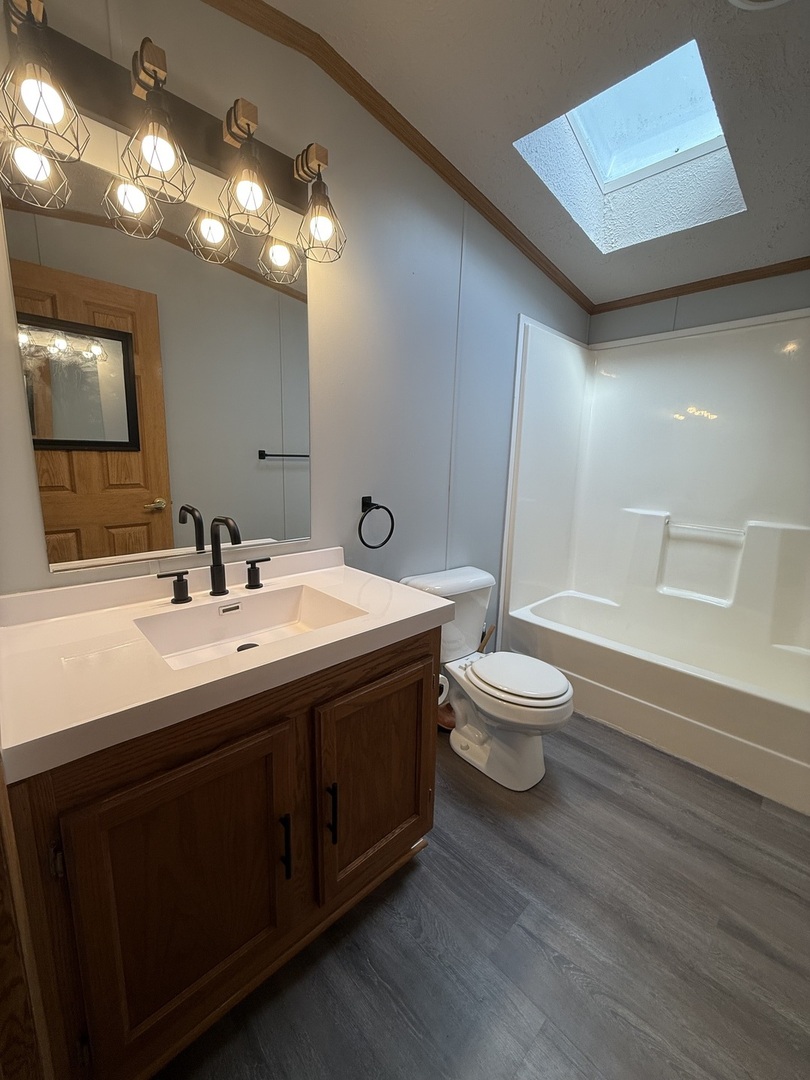 317 Pleasant Terrace Matteson, IL 60443 - Photo 9 of 23 a bathroom with a double vanity sink toilet and a mirror