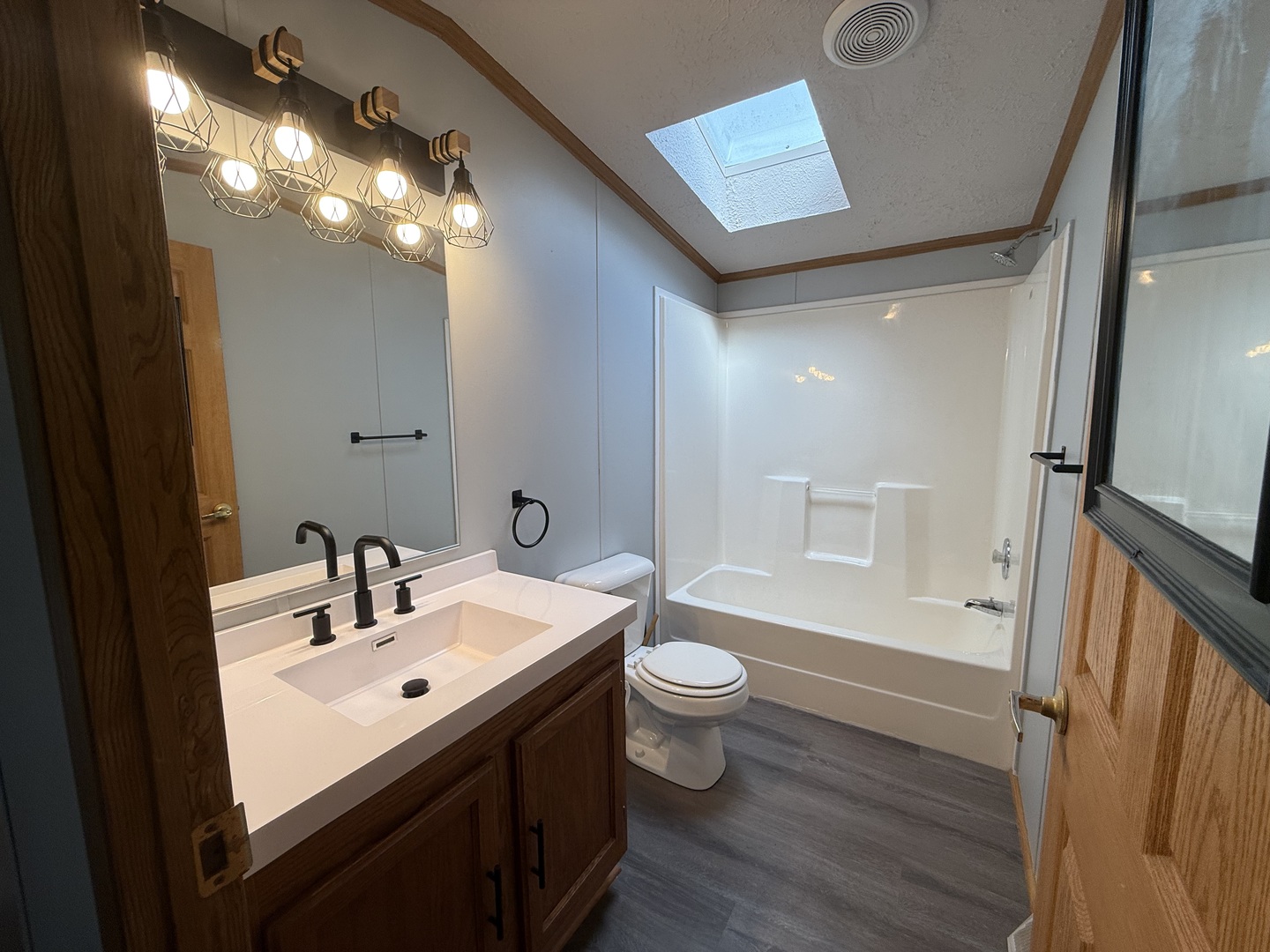 317 Pleasant Terrace Matteson, IL 60443 - Photo 10 of 23 a bathroom with a sink toilet a mirror and shower