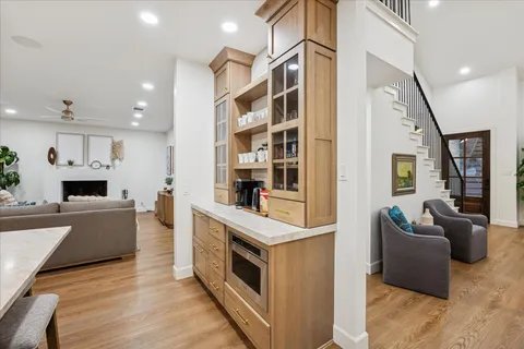 a bedroom with a bed and large mirror