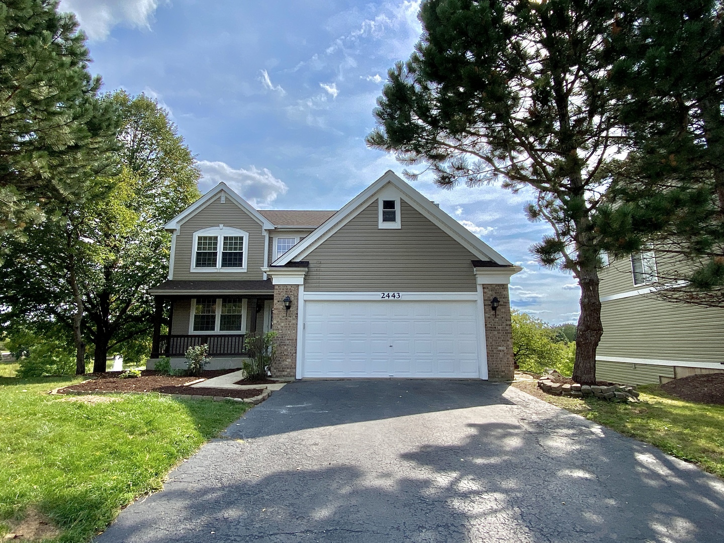 2443 Baldwin Court Aurora, IL 60503 - Photo 1 of 51 a house view with a garden space