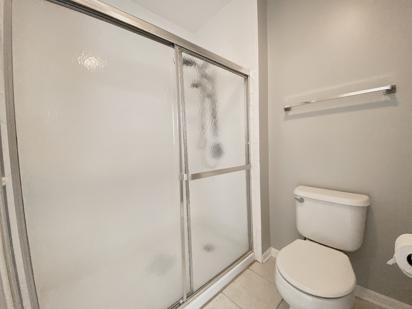 2443 Baldwin Court Aurora, IL 60503 - Photo 24 of 51 a white toilet sitting next to a shower