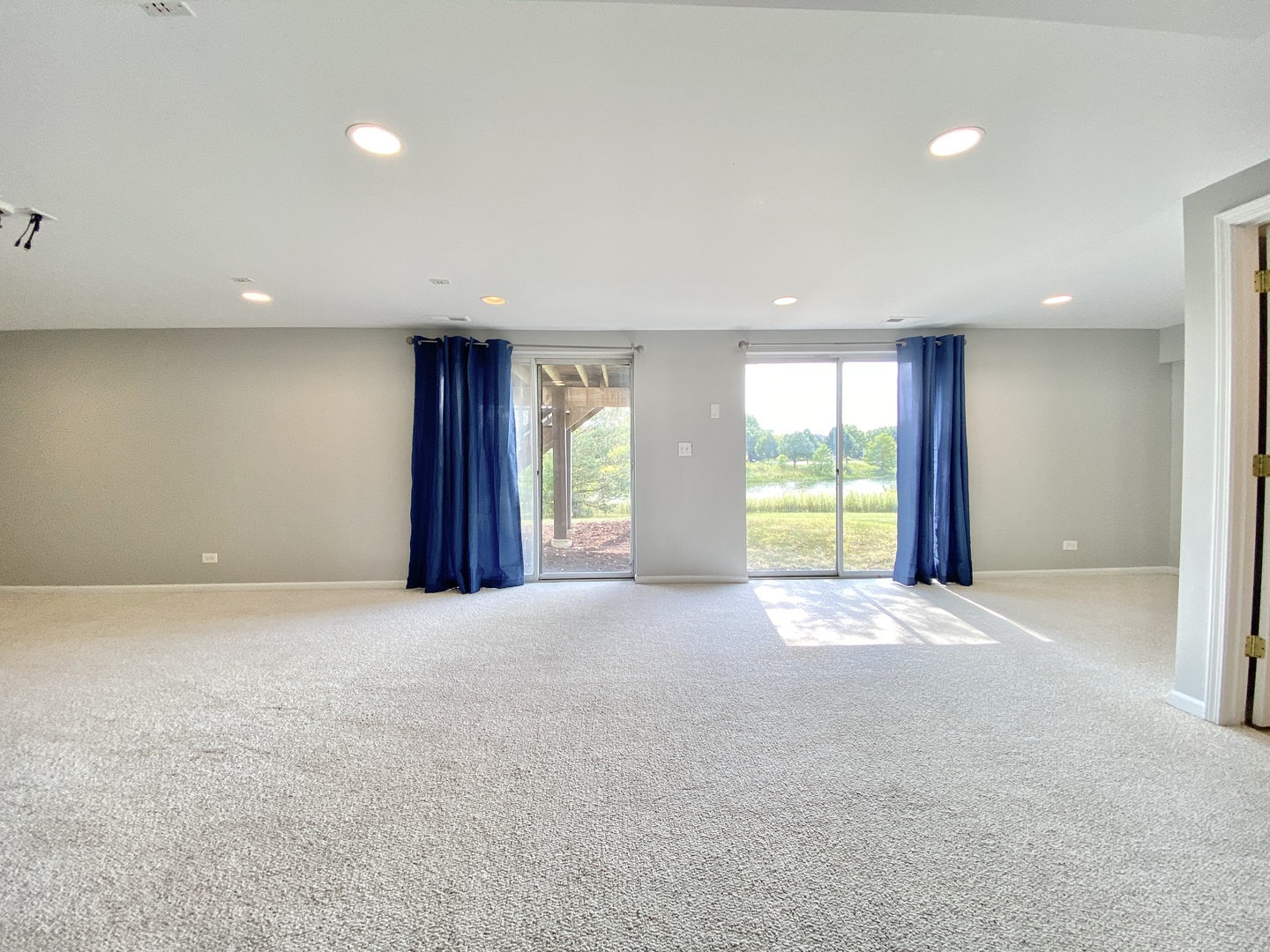 2443 Baldwin Court Aurora, IL 60503 - Photo 32 of 51 a view of an empty room with window and a kitchen