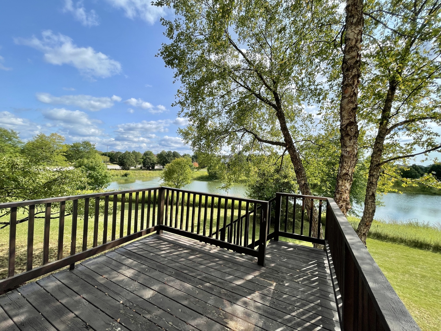 2443 Baldwin Court Aurora, IL 60503 - Photo 36 of 51 a view of balcony with wooden floor and fence