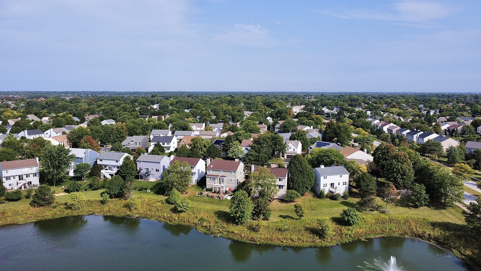 2443 Baldwin Court Aurora, IL 60503 - Photo 41 of 51 an aerial view of a house with a lake view