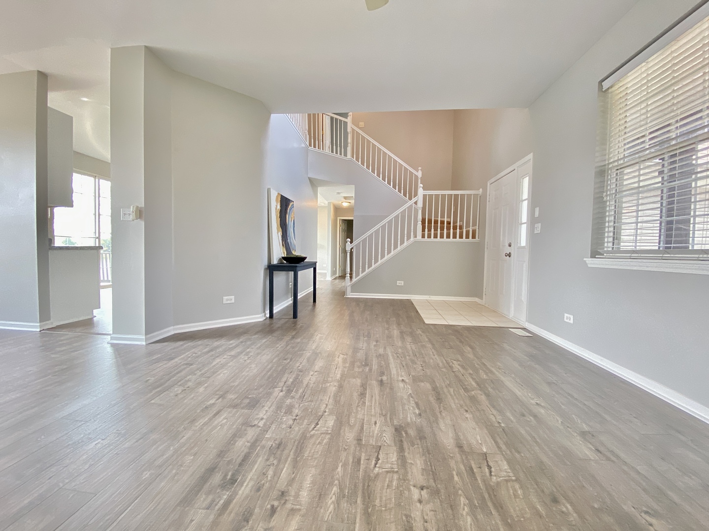 2443 Baldwin Court Aurora, IL 60503 - Photo 5 of 51 a view of empty room with wooden floor and fan