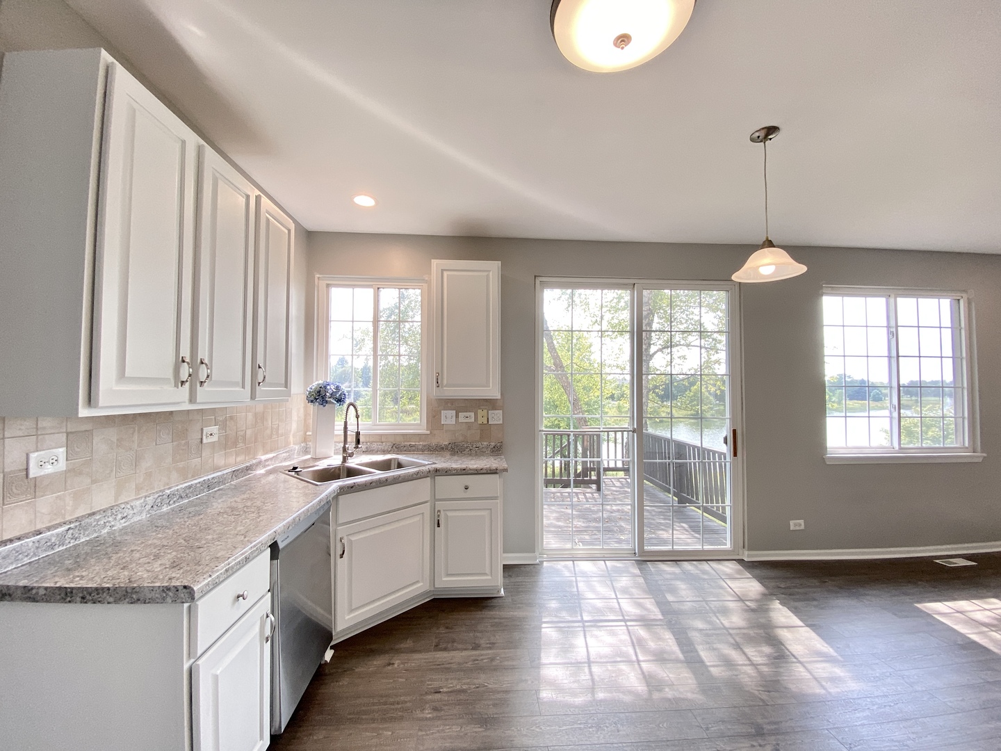 2443 Baldwin Court Aurora, IL 60503 - Photo 10 of 51 a kitchen that has a sink and a large window