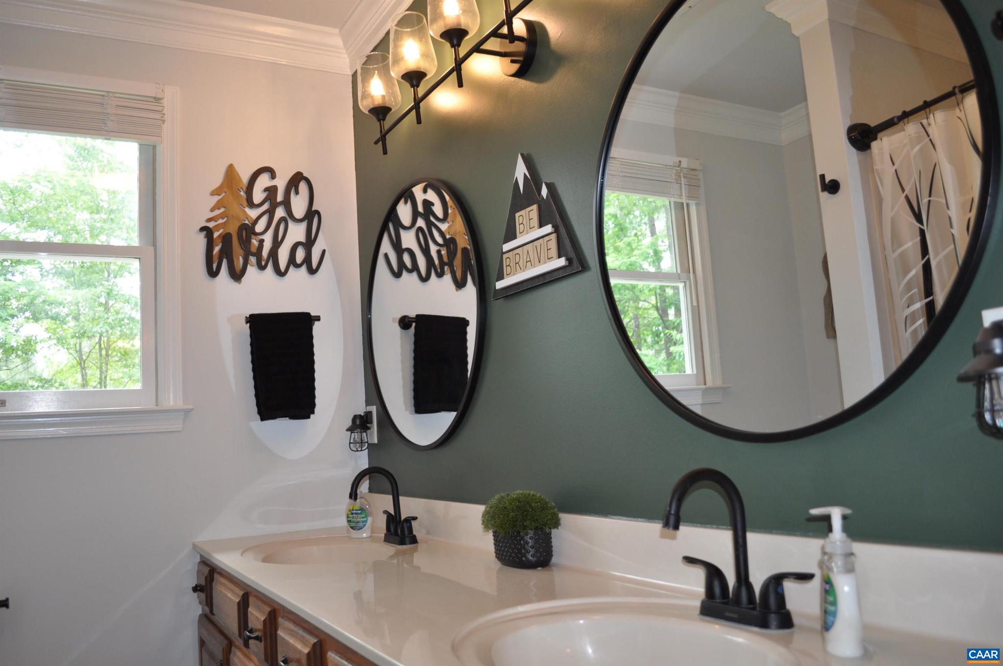 3257 Martin Kings Road Charlottesville, VA 22902 - Photo 32 of 49 a bathroom with a sink and a mirror