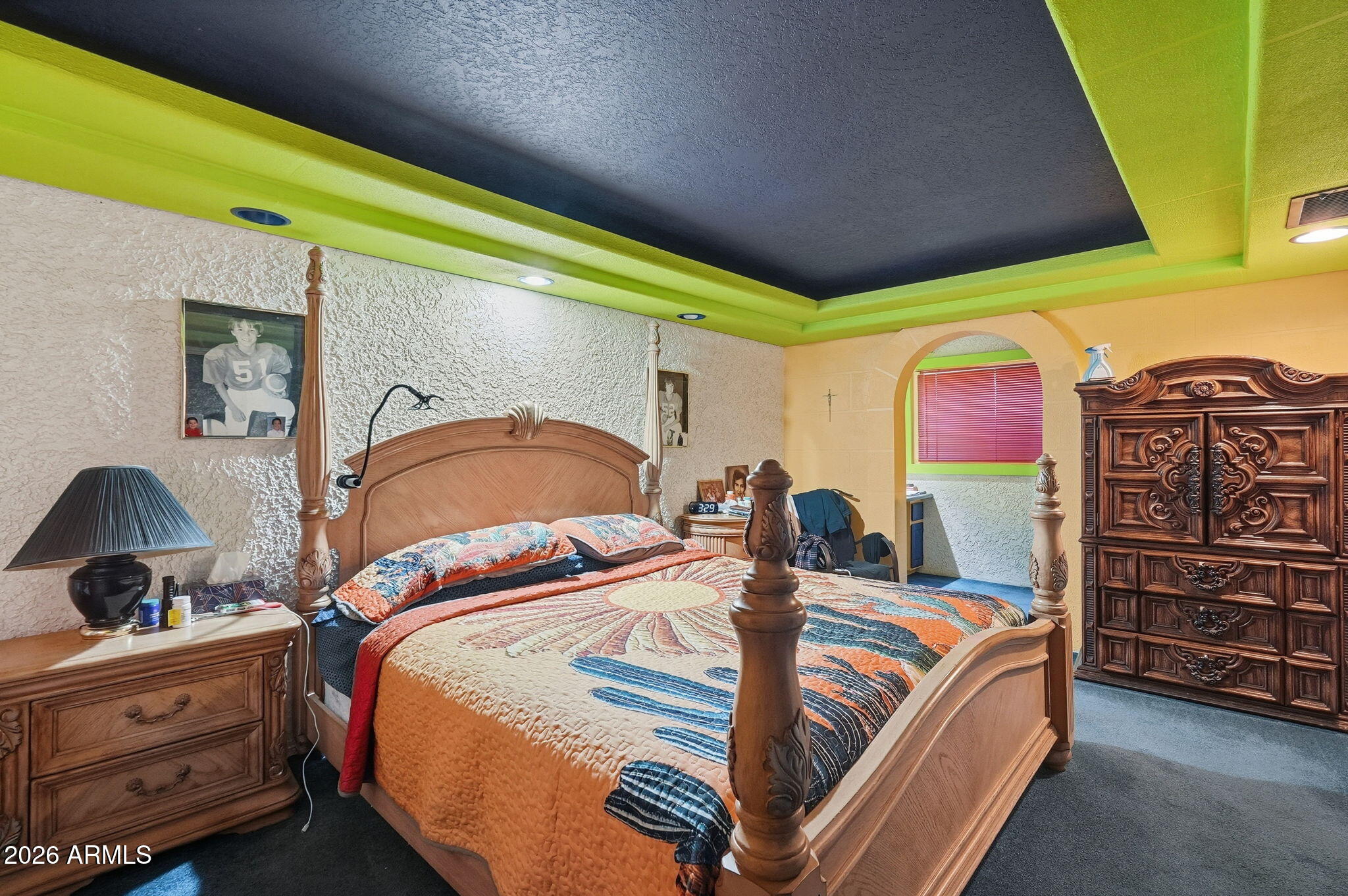 4702 East Alta Vista Road Phoenix, AZ 85042 - Photo 12 of 20 a bedroom with a bed and dresser