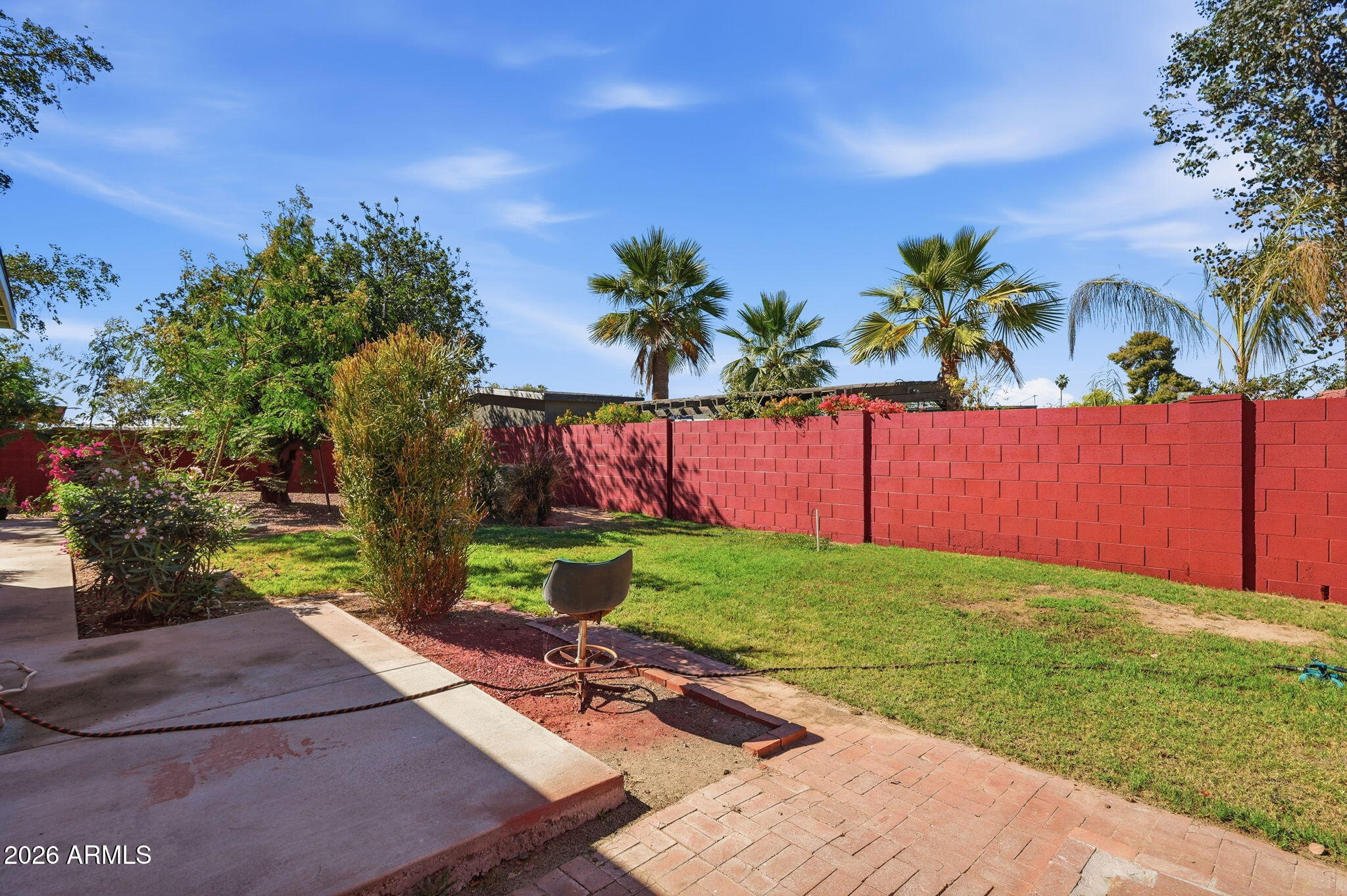 4702 East Alta Vista Road Phoenix, AZ 85042 - Photo 16 of 20 a view of a backyard with a garden