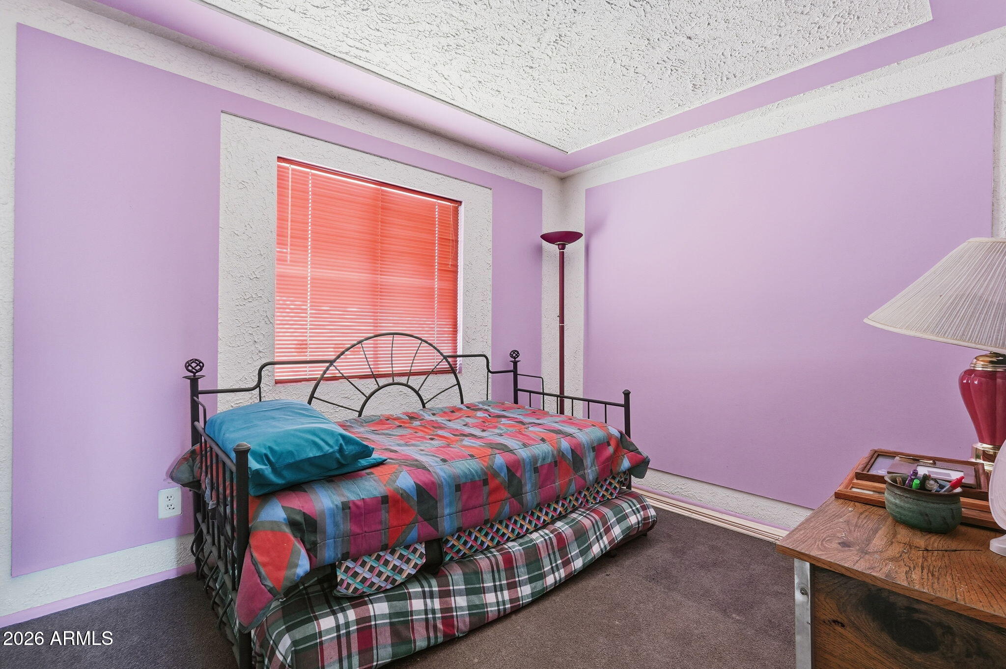 4702 East Alta Vista Road Phoenix, AZ 85042 - Photo 10 of 20 a bedroom with a bed and a window