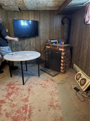 a room with furniture and air hockey table