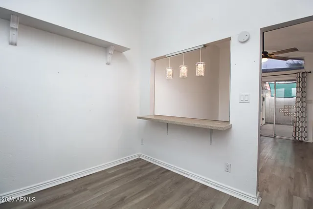 a view of a livingroom with wooden floor