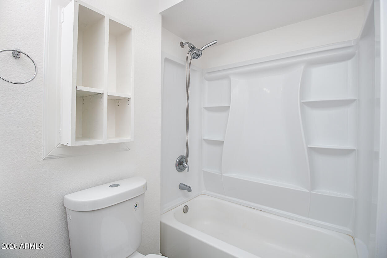 555 North May, Unit 3 Mesa, AZ 85201 - Photo 15 of 26 a bathroom with a bathtub a toilet and a shower