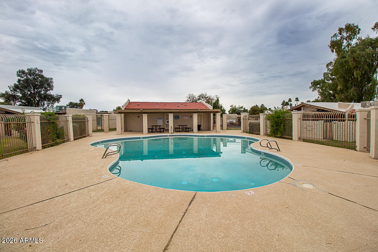 555 North May, Unit 3 Mesa, AZ 85201 - Photo 24 of 26 a view of a house with a swimming pool