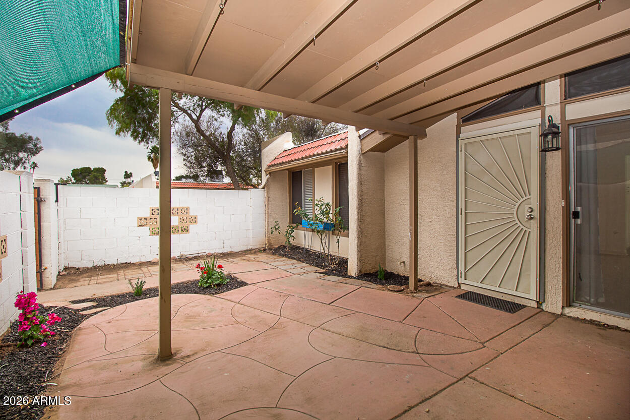 555 North May, Unit 3 Mesa, AZ 85201 - Photo 3 of 26 a view of a porch with furniture
