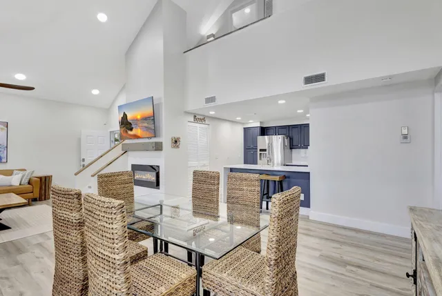 a kitchen with stainless steel appliances granite countertop a refrigerator stove and microwave