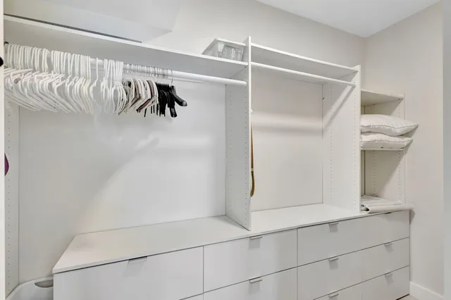 a view of a chair and table in the balcony