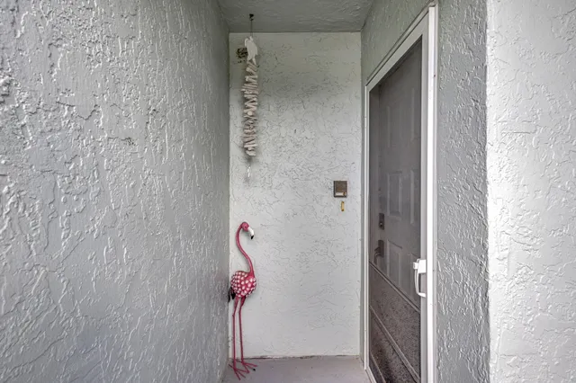 a living room with furniture a rug and a chandelier