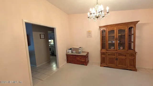 a view of an entryway with a chandelier