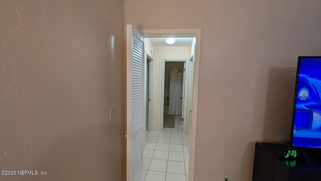 en empty room with fan and window