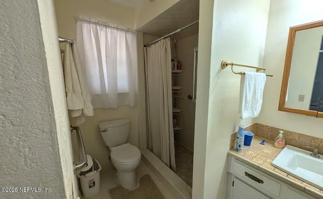 a close up view of a sink and a mirror