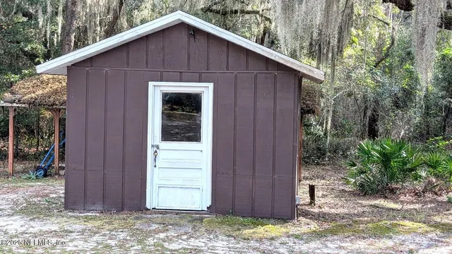 a wooden house with a small yard