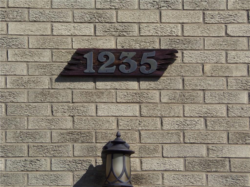 1235 North Main St Extension Butler, PA 16001 - Photo 2 of 22 WELCOME to 1235 N. Main St. Ext (located off the private front road parallel to Main St) --ALL BRICK, PLASTER WALLS, HARDWOOD FLOORS, 2 FIREPLACES, PATIO --Features New Dimensional Shingled Roof, All new outdoor lighting, all Trim & Garage Doors newly painted,Completely painted interior plus entire basement & garage, New Baths with all new fixtures, lighting, flooring; refinished hardwood floors, new Floors in Kitchen and Baths, New Rug in Gameroom