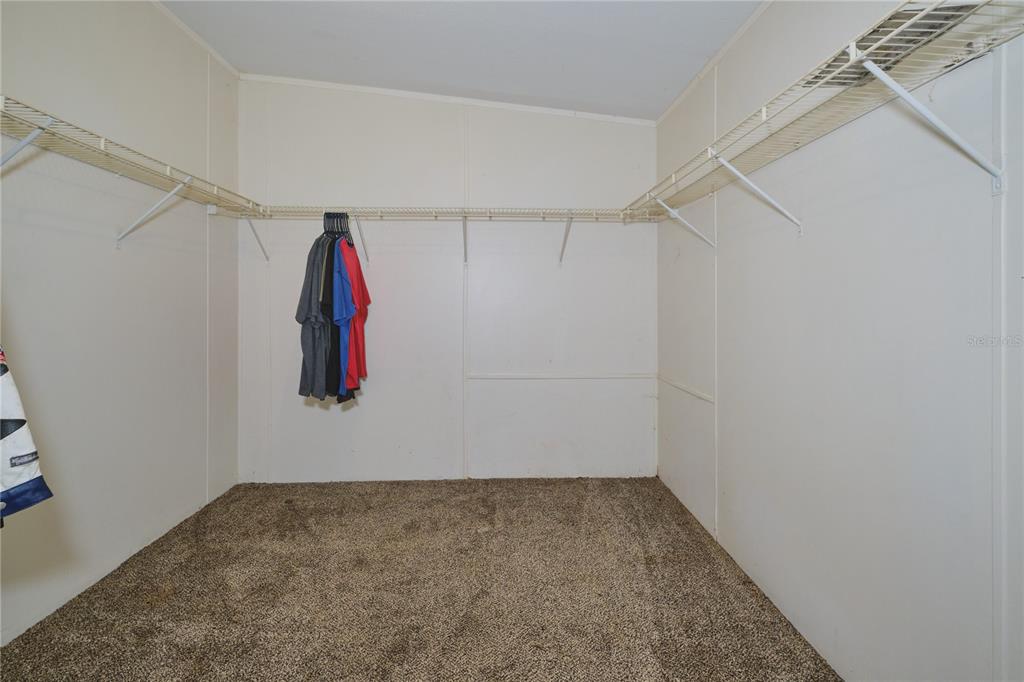 2701 Murphy Road Ona, FL 33865 - Photo 21 of 41 a view of walk in closet with clothes and shoes