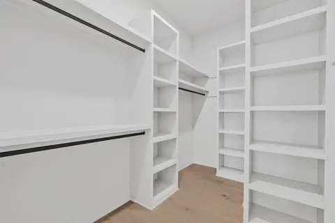 a view of an empty walk in closet