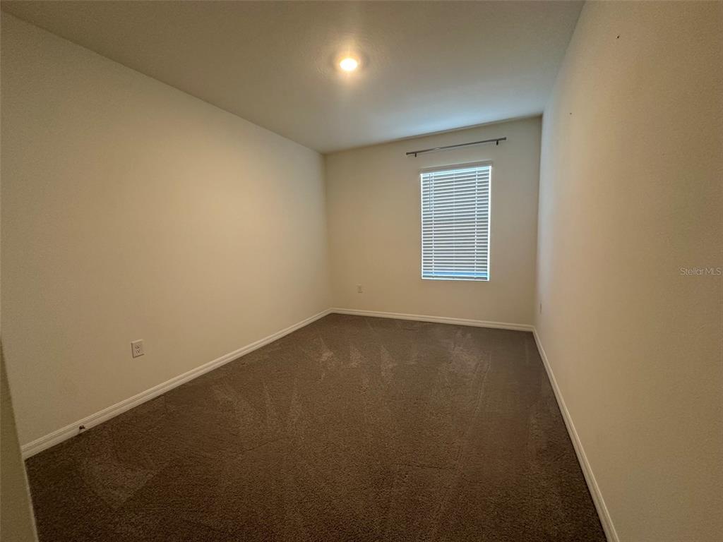 33762 Jasmine Star Loop Wesley Chapel, FL 33543 - Photo 11 of 27 an empty room with a window