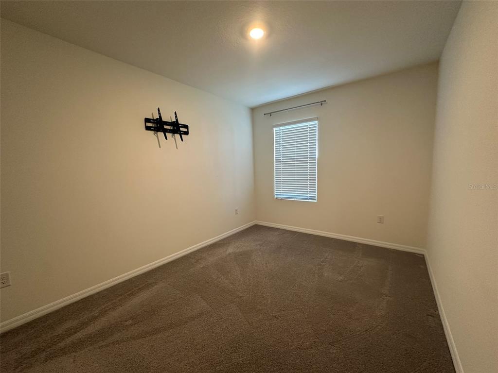 33762 Jasmine Star Loop Wesley Chapel, FL 33543 - Photo 14 of 27 an empty room with windows and closet