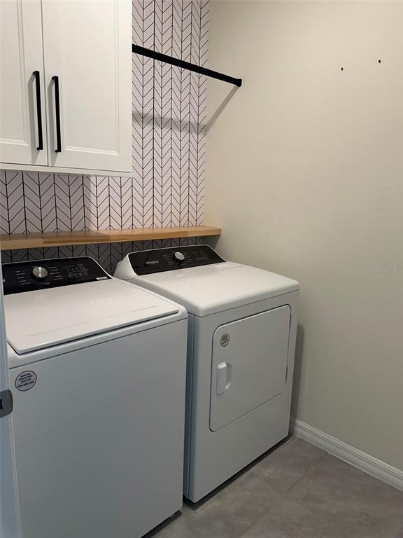 33762 Jasmine Star Loop Wesley Chapel, FL 33543 - Photo 24 of 27 a utility room with dryer and washer