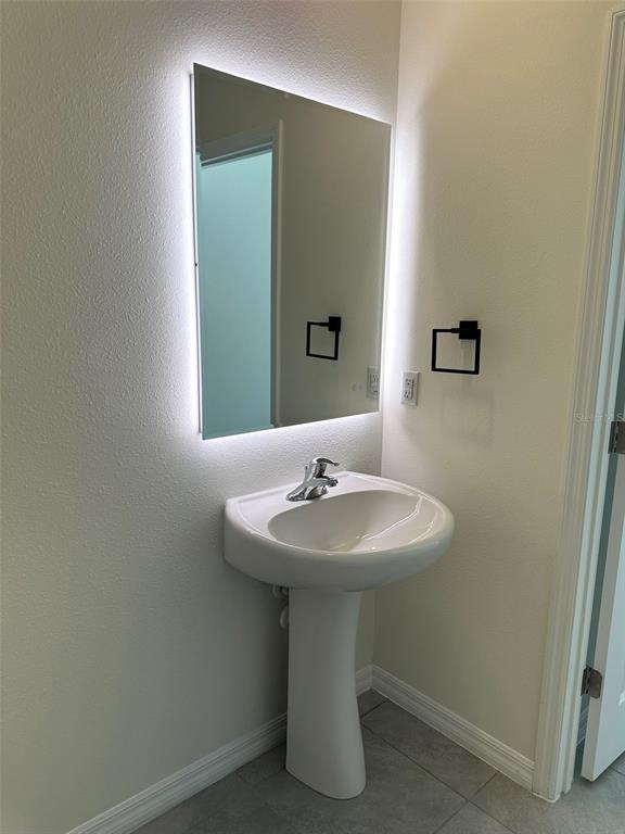 33762 Jasmine Star Loop Wesley Chapel, FL 33543 - Photo 9 of 27 a bathroom with a sink and a mirror