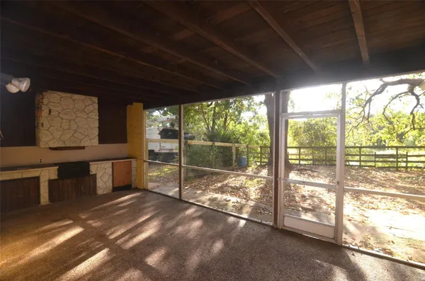 a view of an empty room with windows