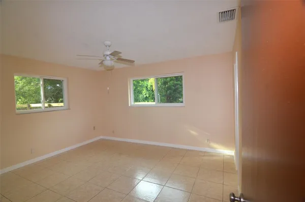a view of an empty room with a window